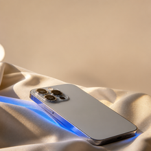 iPhone 15 Pro Natural Titanium - cream backdrop